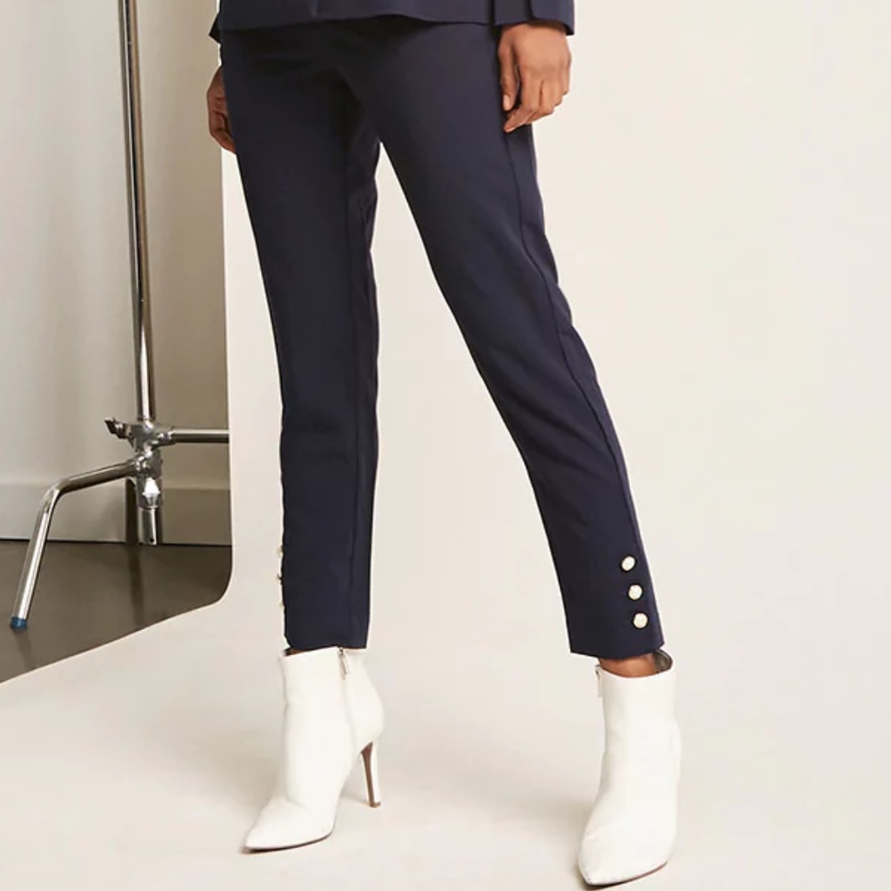 Dark blue pants with pearl detail along the leg